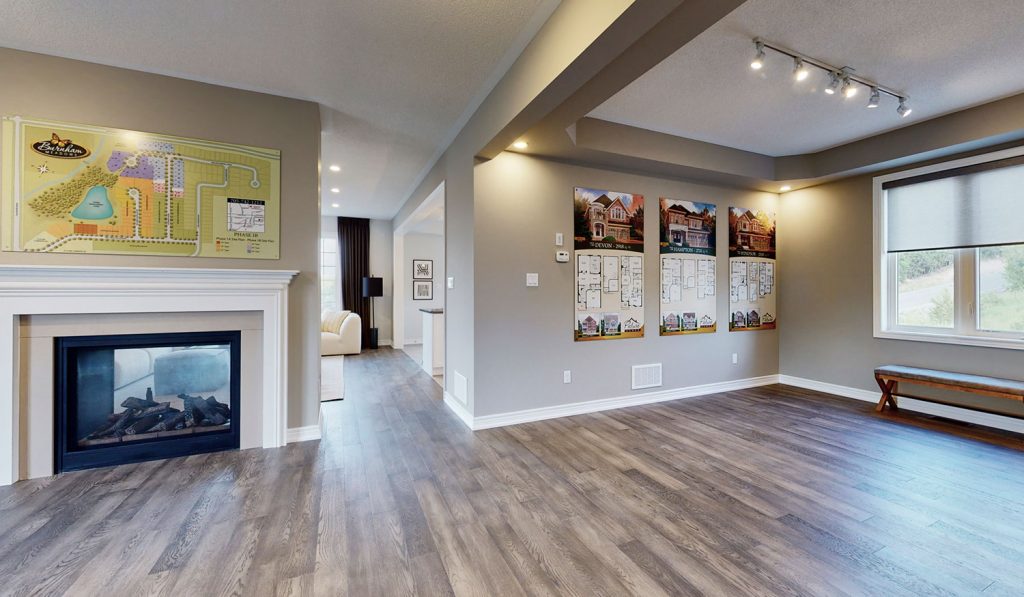 Picture Homes Model Home - Fire Place and Hallway Leading to Kitchen and Family Living Room