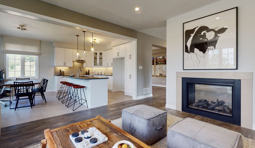 Picture Homes Model Home - Fire Place in Family Living Room Beside Kitchen Area