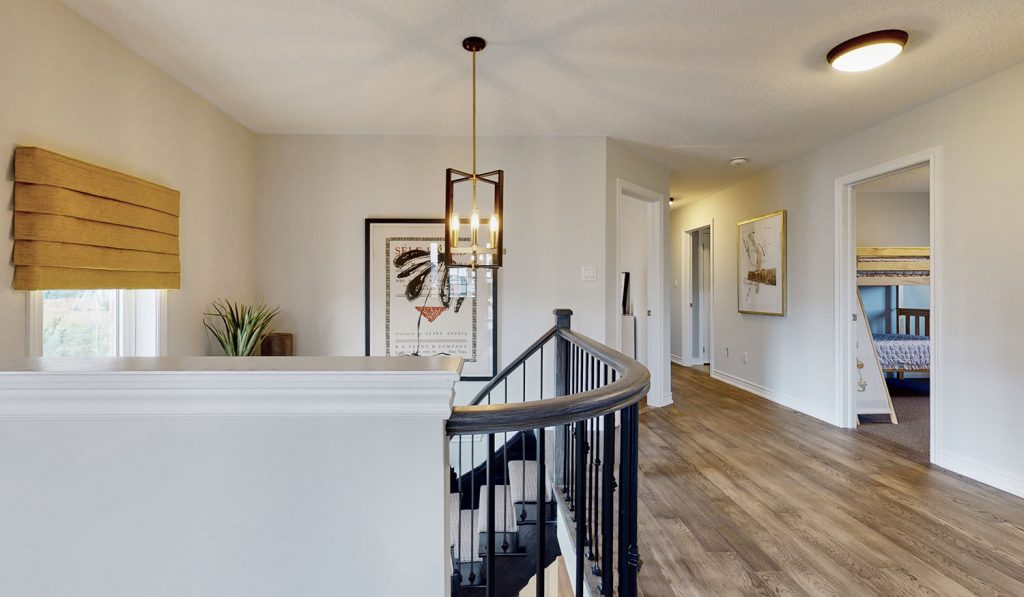 Picture Homes Model Home - View of Upstairs Hallway Leading to Bedrooms and Washrooms