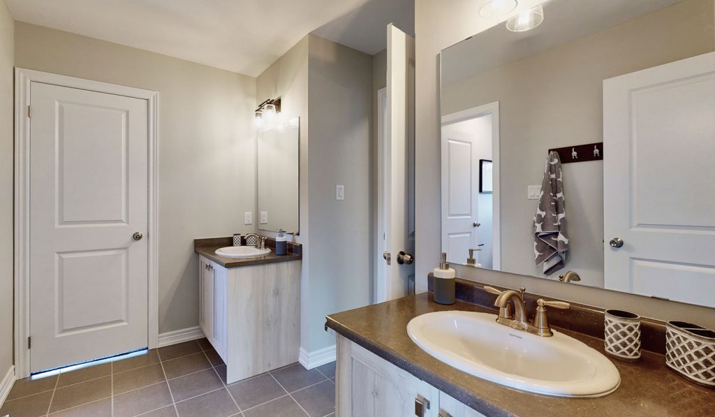 Picture Homes Model Home - Ensuite Washroom with Two Sinks and Large Mirrors