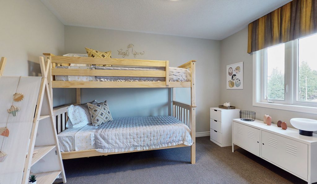 Picture Homes Model Home - Bunk Beds and Small Dresser in Second Bedroom