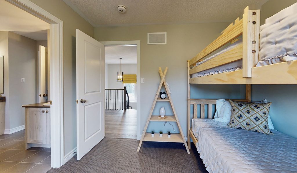 Picture Homes Model Home - Bedroom With Bunk Beds and Ensuite Connecting Washroom