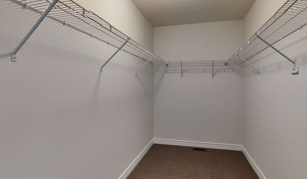 Picture Homes Model Home - Large Walk in Closet with Shelving