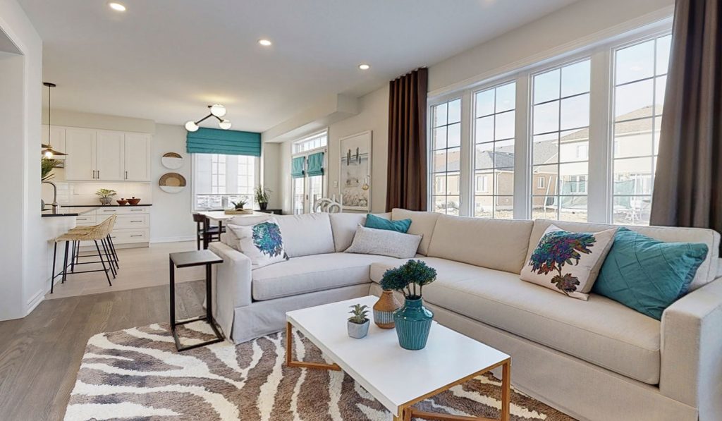 Picture Homes The Hampton Model Home - Family Room Living Space with Large Windows and Natural Light