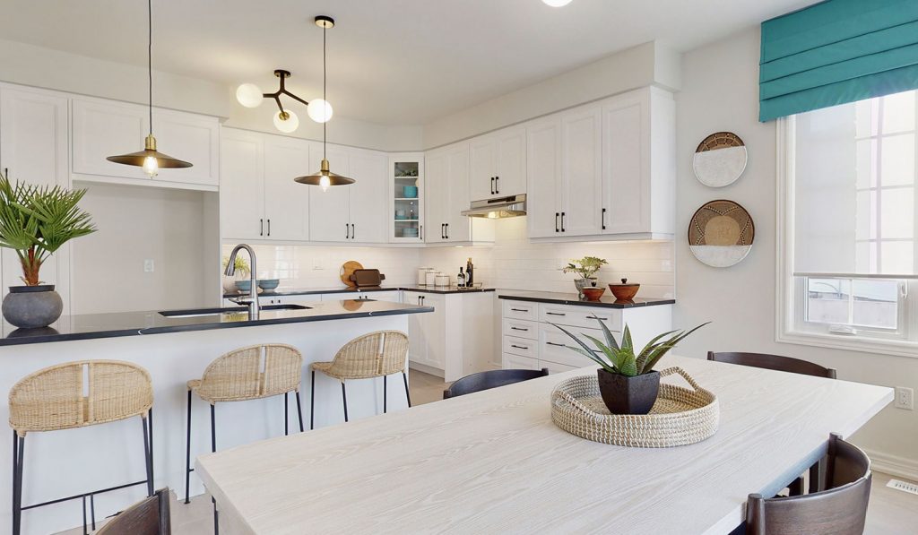 Picture Homes The Hampton Model Home - Kitchen Dining Table and Island with Bar Chairs