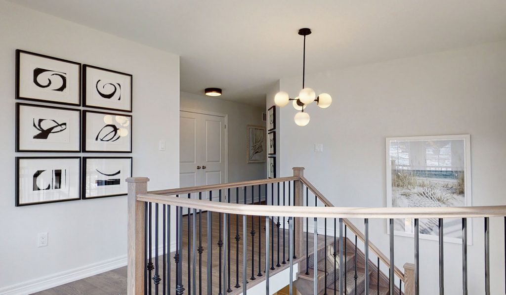 Picture Homes The Hampton Model Home - Upstairs Hallway and Staircase on Second Floor