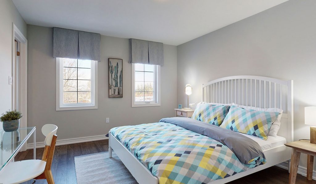 Picture Homes The Hampton Model Home - Double Bed with Bedframe and Lots of Natural Light in Upstairs Bedroom