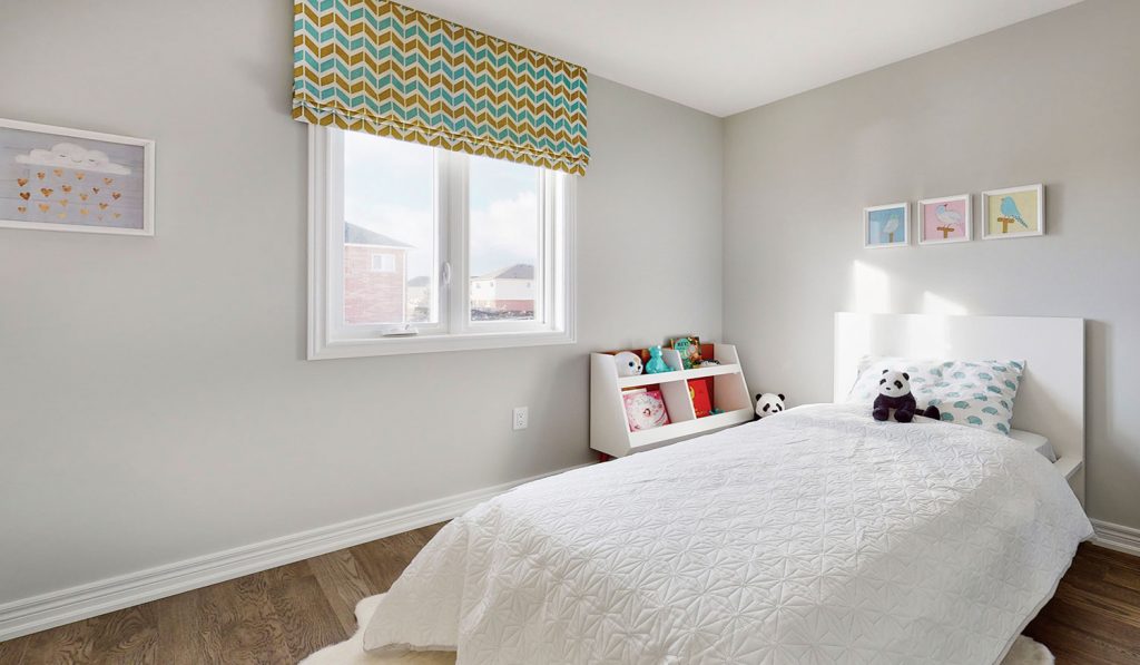 Picture Homes The Hampton Model Home - Bedroom With Natural Light and White Walls