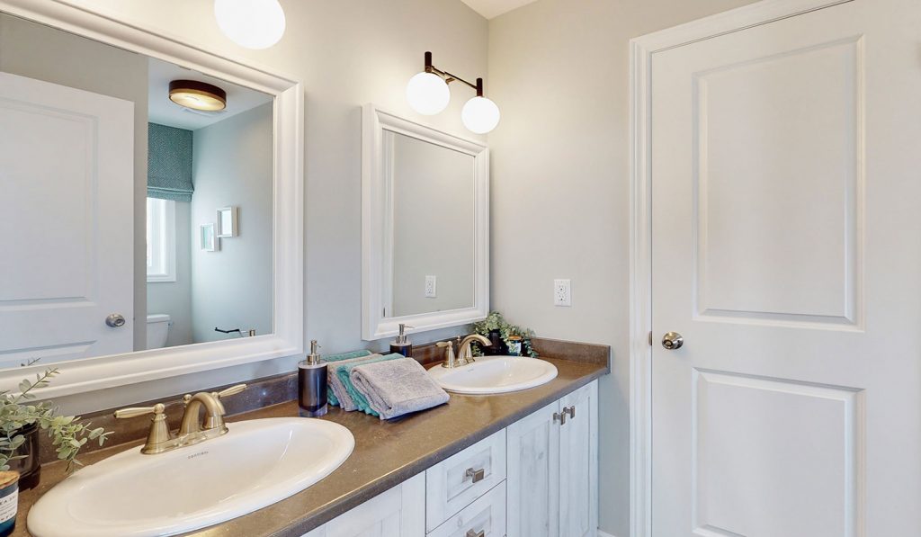 Picture Homes The Hampton Model Home - Two Sinks and Two Mirrors in Shared Bathroom