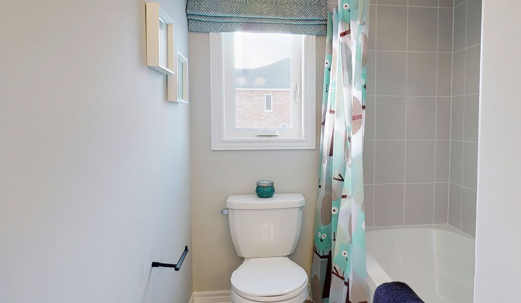 Picture Homes The Hampton Model Home - Window Above Toilet in Powder Room