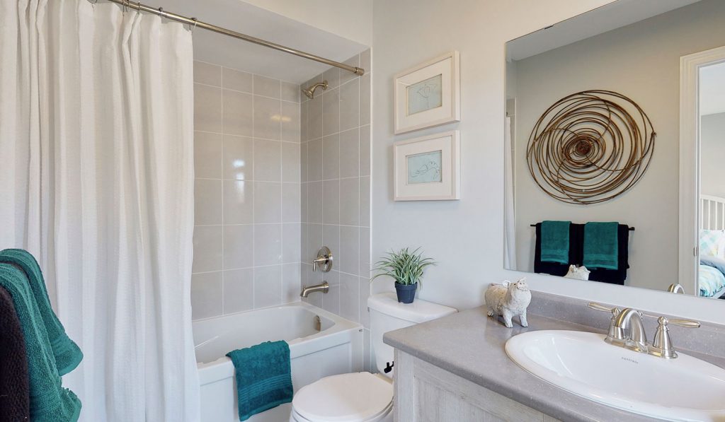 Picture Homes The Hampton Model Home - Full Bathroom With Bathtub Shower, Toilet, and Sink